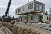 Commercial modular building modules being installed on prepared foundations